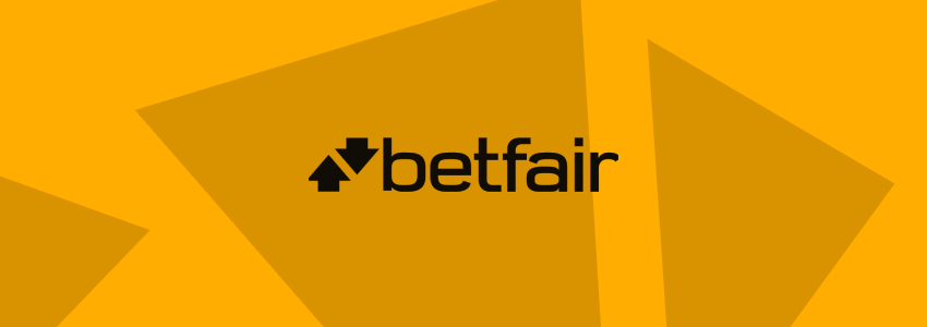 Divulgação da Betfair no SDA. A marca da casa de apostas aparece ao centro, em tons negros, contra fundo estilizado com a identidade visual do site.